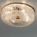 Ceiling light fixture with clear glass shade and gold frame