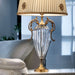 Gold and clear glass table lamp with decorative shade