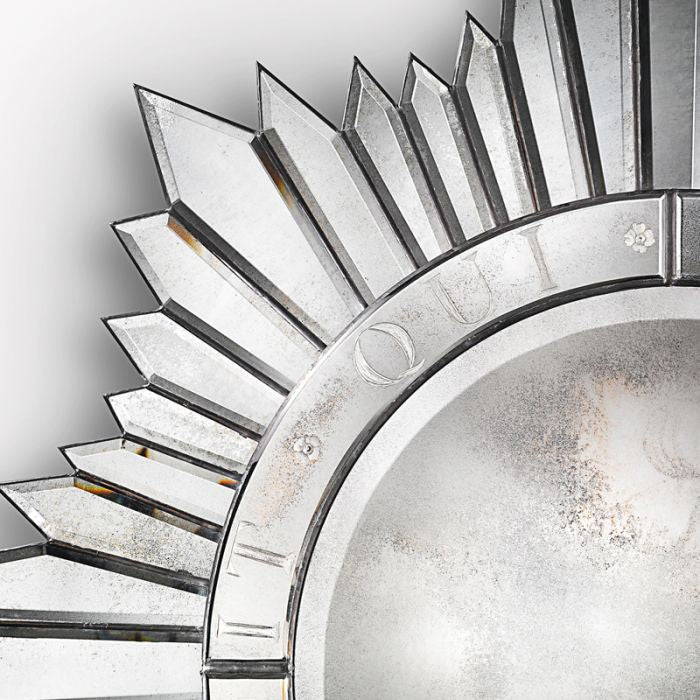 Silvered sun-burst wall mirror in the art deco style