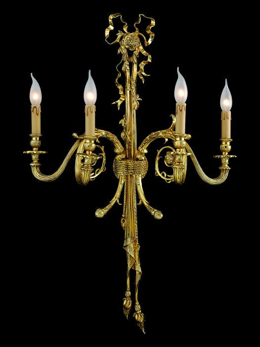 Large antiqued wall sconce in the style of Louis XV